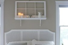12 a shelf over the bed made of a shelf and an old window, some candles, a jug and more decor for a vintage white bedroom