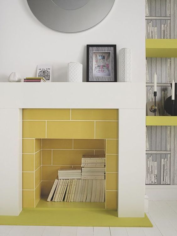 mustard tiles inside the fireplace and a neutral surround create a bold contrast that strikes and makes the space catchier