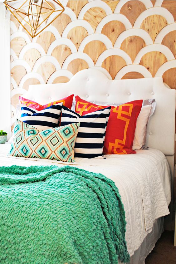 a creative statement wall done with plywood scallops is a very bold and unique idea for your bedroom