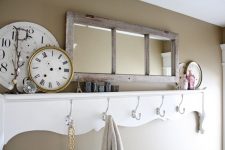 20 an old window frame repurposed into a stylish mirror to hang it in a mudroom or an entryway