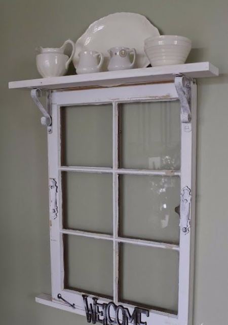 a vintage shelf of an old window frame, some letters and a plank on top, with elegant porcelain is a stylish idea