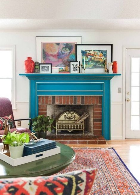 a bright mid-century modern living room with a bold blue mantel over a red brick fireplace, the mantel completely changes the look