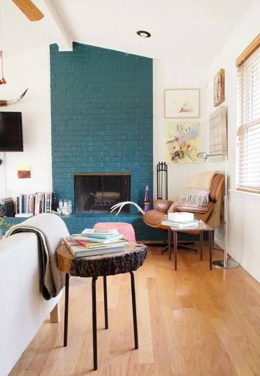 a teal brick fireplace, even a non-working one, is a very non-traditional decor feature to go for