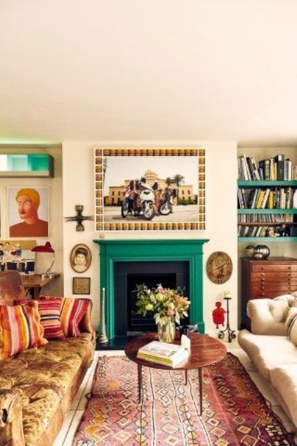 an eclectic living room with a fireplace with an emerald mantel, some sofas, a printed rug, open shelves and a dresser