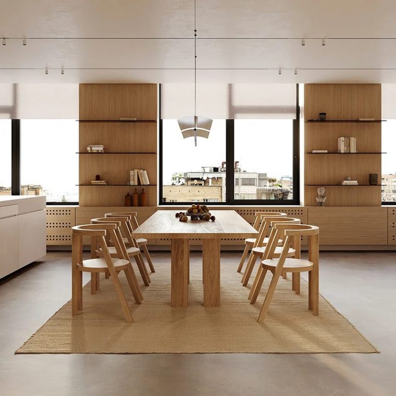 The dining zone is done with a chic table and scultupral chairs that define the look