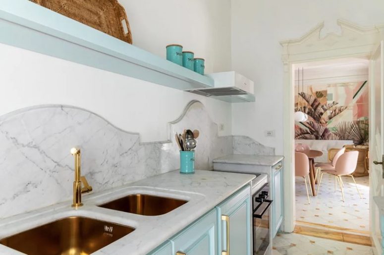 Touches of gold and brass add chic and a refined touch to the space