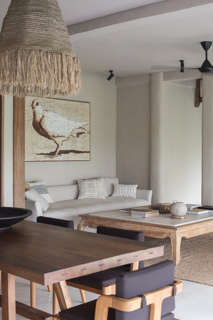 The living room is united with a dining room, here you can see the same wooden furniture and neutral pieces The living room is united with a dining room, here you can see the same wooden furniture and neutral pieces
