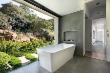 a modern bathroom design with a cool courtyard view