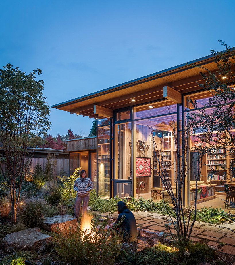 There's a cozy patio with much greenery and lights, and all the spaces are connected to it