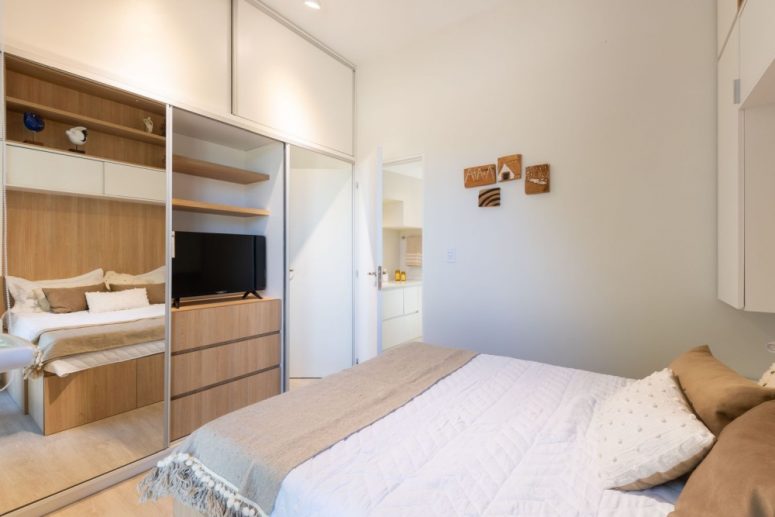 The bedroom shows off much hidden storage space, a comfy bed and some lights - who needs more in such a space