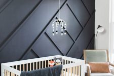 a dark wall is a trendy solution for a contemporary nursery