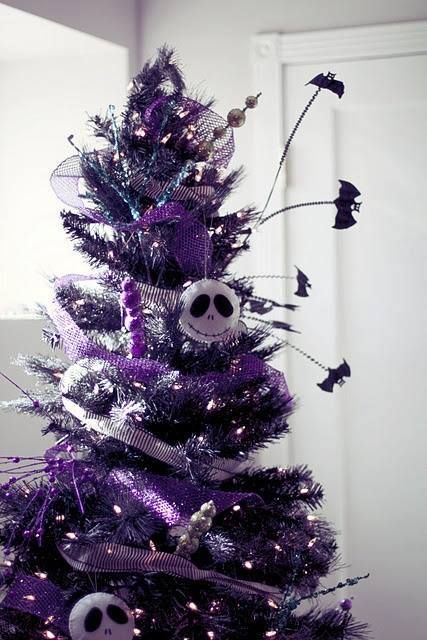 a shiny purple Christmas tree with lights, bats, beads and sheer Skellington ornaments is a bold solution for Christmas