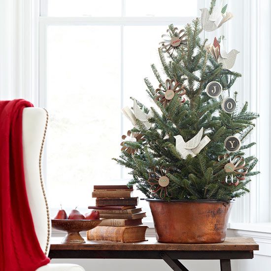 a vintage rustic tabletop Christmas tree with paper birds, chalkboard ornaments and cardboard ones is a lovely and eays idea