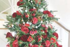 unique tabletop Christmas tree decor done with red berries, red and burgundy blooms and some silver ornaments is chic and glam