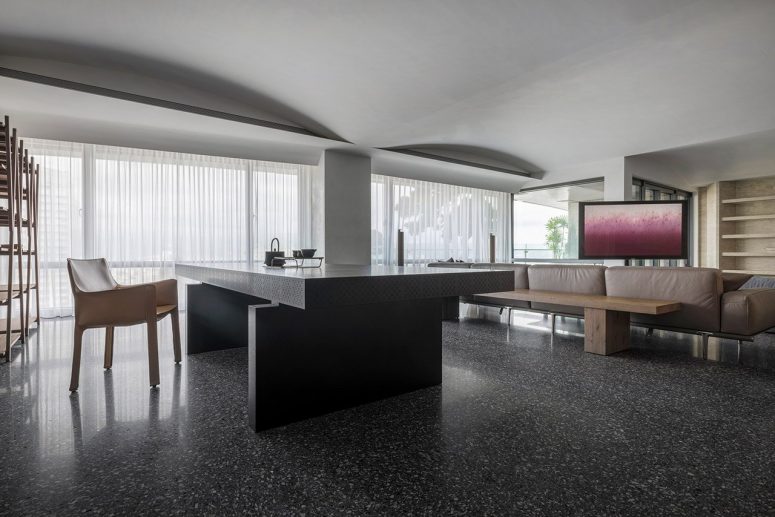 This sculptural minimalist apartment is done with a selection of catchy materials to make it look cooler This sculptural minimalist apartment is done with a selection of catchy materials to make it look cooler
