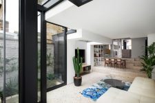 01 This stylish contemporary house extension was created for a Victorian terraced house and features cool materials and textures