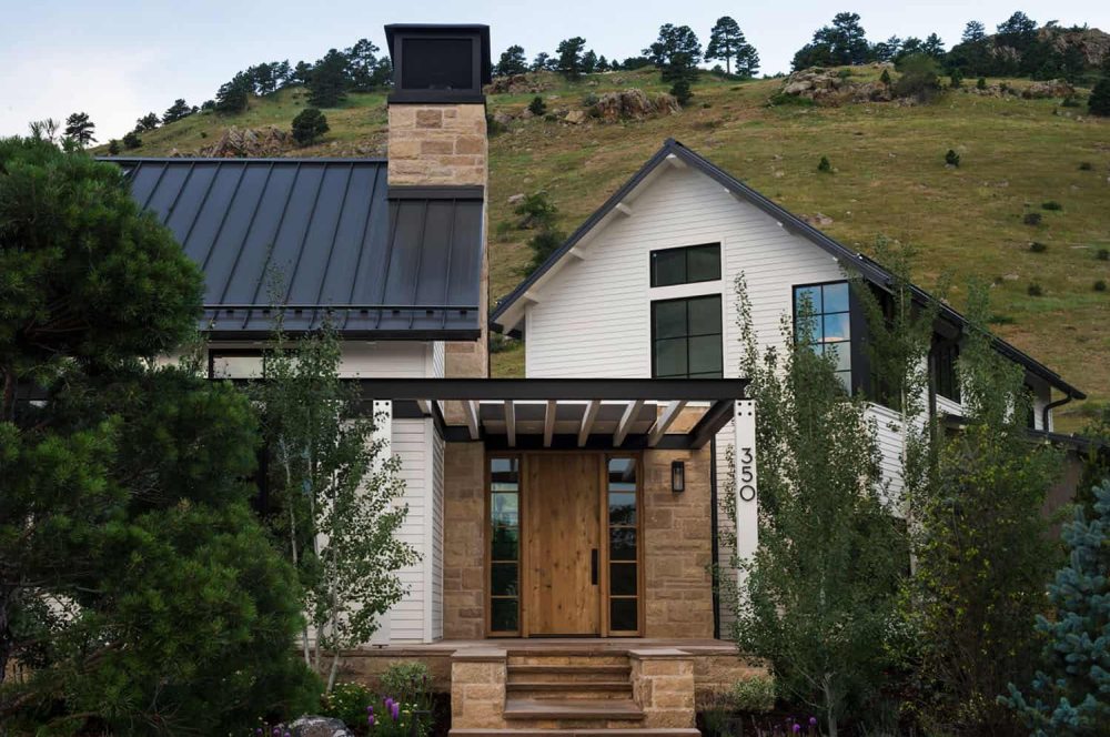 This stylish modern farmhouse features three structures and a strong connection to outdoors