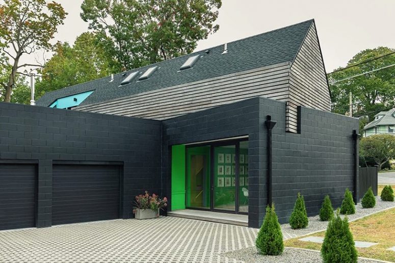 This stylish modern house is built in NYC suburbs and its facade is inspired by 1930s houses that surround it