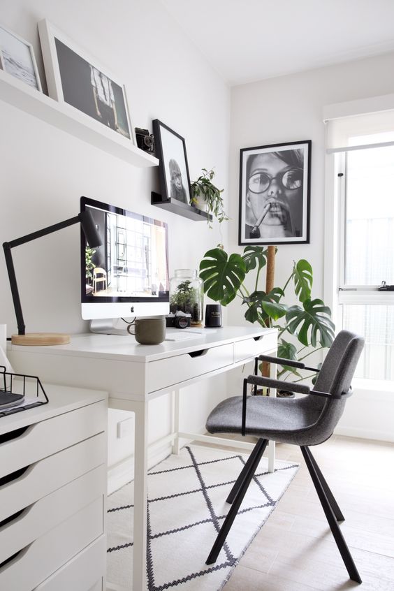 a stylishly organized Scandinavian home office with minimalist touches is a cool space to work in