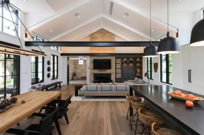 The main space is an open layout with a dining room, family room and a kitchen space, it's filled with natural light and features cool views