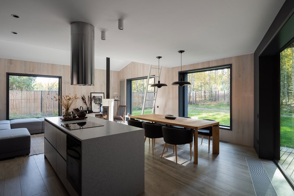 The main space is comprised of three parts   a kitchen, a dining room and a sitting zone, with stylish minimalist furniture and gorgeous unbstructed views