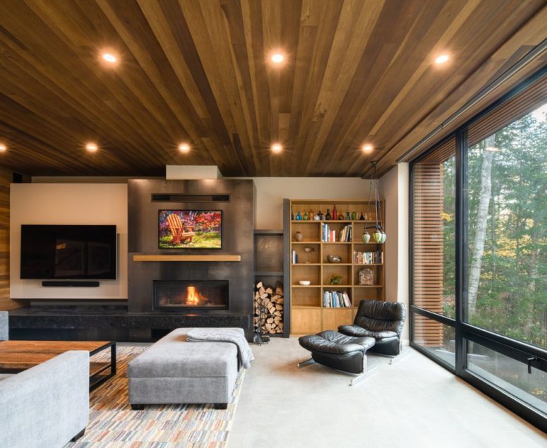 a cozy living room with a built in fireplace The living room shows off a built-in fireplace, upholstered and leather furniture, lights and a bright rug