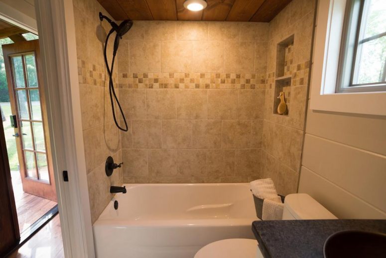 The bathroom is big enough for a bathtub, with space left for a toilet and a vanity