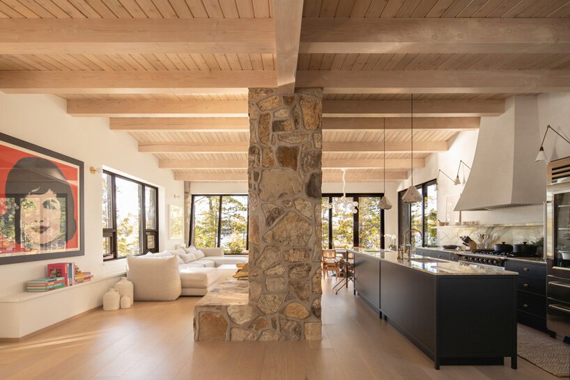 The kitchen shows off navy lower cabinets and a large white hood, marvellous views are everywhere