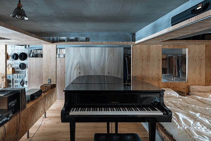 There's a sleeping zone separated with a large piano from the rest of the house