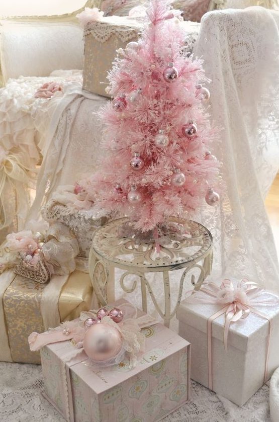 a blush Christmas tree with blush and pink ornaments is a cool idea for any vintage glam space