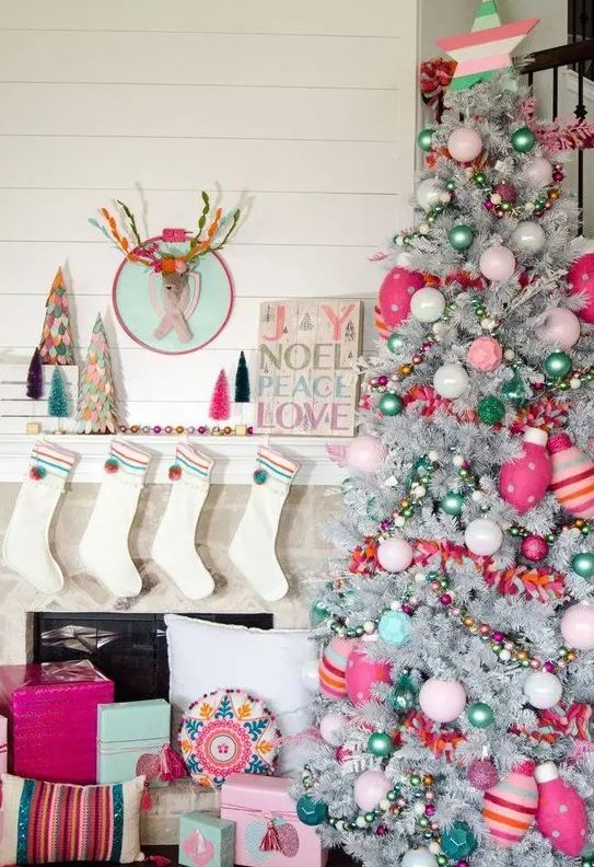 a bright and fun Christmas silver tree with pink, hot pink and green ornaments, beads and striped ornaments and stars