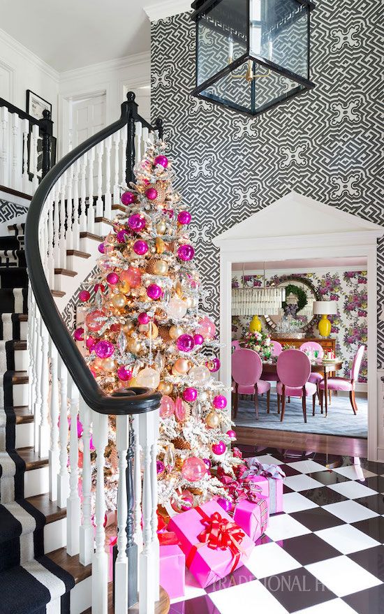 a glam flocked chrismtas tree decorated with lots of pink ornaments