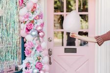 a lovely pink Christmas garland of balloons, pink ornaments, faux blooms and some greenery is a beautiful idea