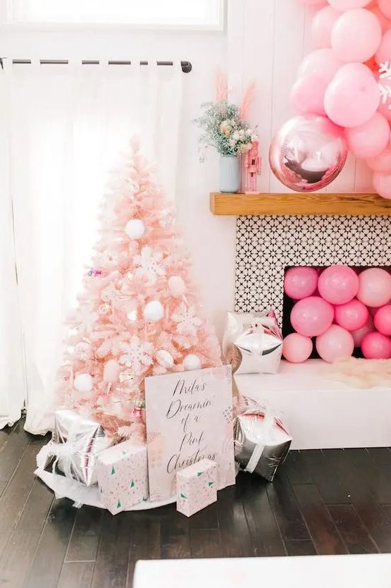 a pastel pink Christmas tree decorated with white pompoms, ice cream cones, snowflakes is a dreamy and pretty idea for a glam space