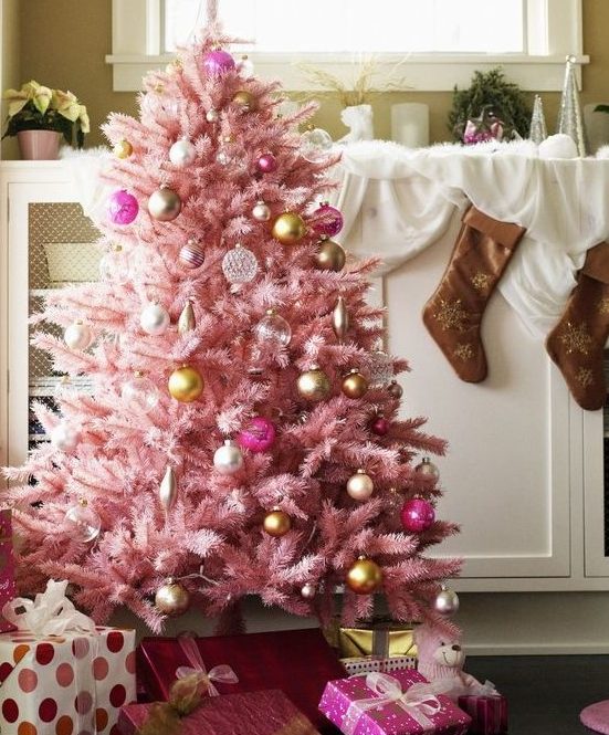 a pastel pink Christmas tree with sheer, gold and pink ornaments with a vintage feel looks very sophisticated