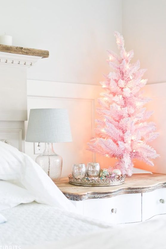 a pink tabletop Christmas tree with lights will add a little bit of glam and fun to your bedroom or some other room
