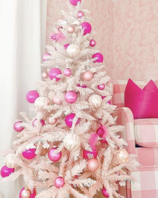 a white Christmas tree decorated with pearly, light and hot pink ornaments and some rainbows is a amazing for the holidays