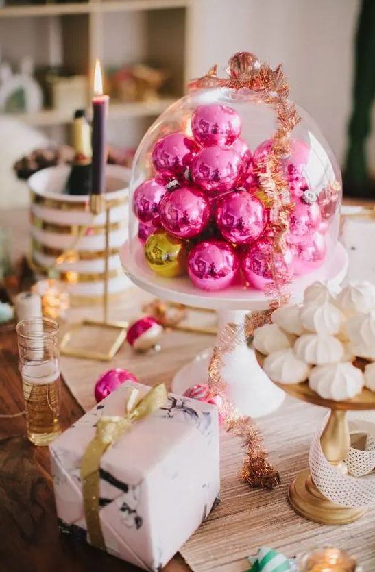 hot pink Christmas ornaments in a cloche will become a lovely Christmas centerpiece or a decoration for a dessert table