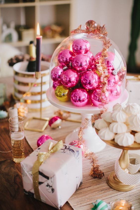 hot pink Christmas ornaments in a cloche will become a lovely Christmas centerpiece or a decoration for a dessert table
