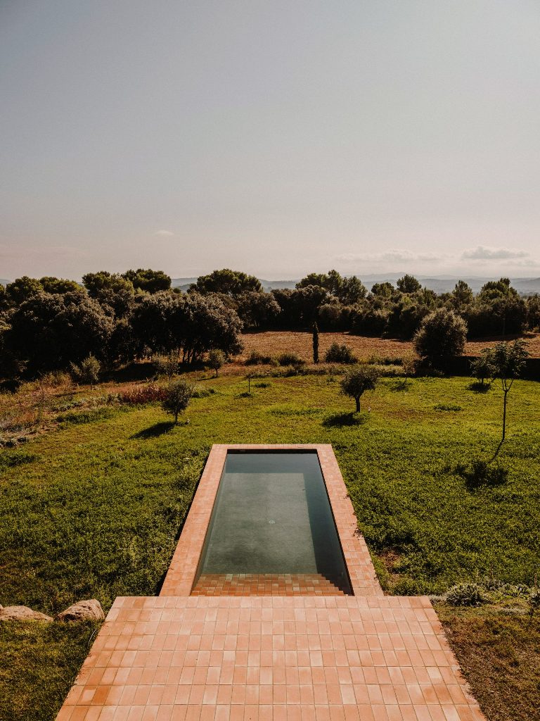 The tiles are local and are used both inside and outside cladding the pool