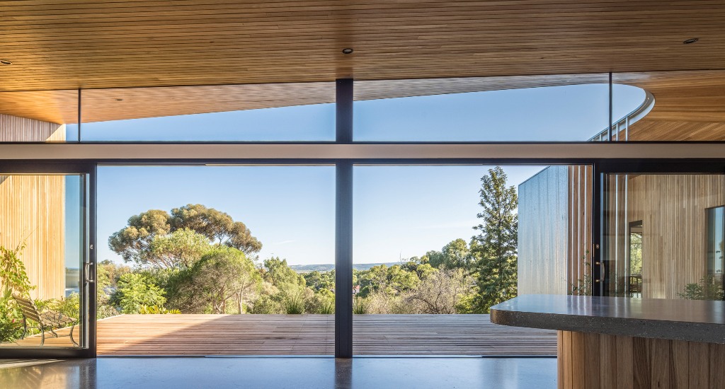 The inner decor echoes with the outer, there's some wood, stone and glass to enjoy the views