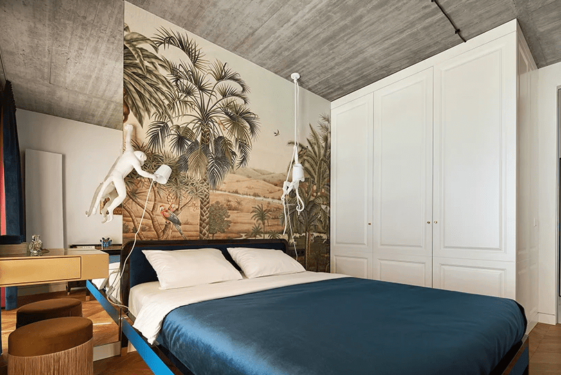 There's a large white storage unit, a closet maybe, and a large mirror reflects the light making the space larger