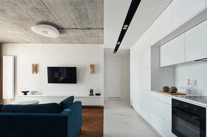 The entryway is white and sleek and you may see a white marble floor here