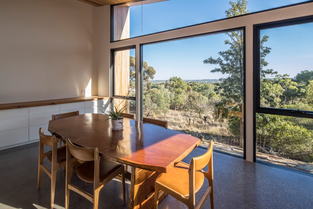The studio could be used as a workspace or separate living room and it shows off amazing views