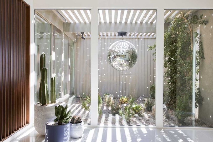 09 The entryway has a disco ball reflecting the light around the atrium walls