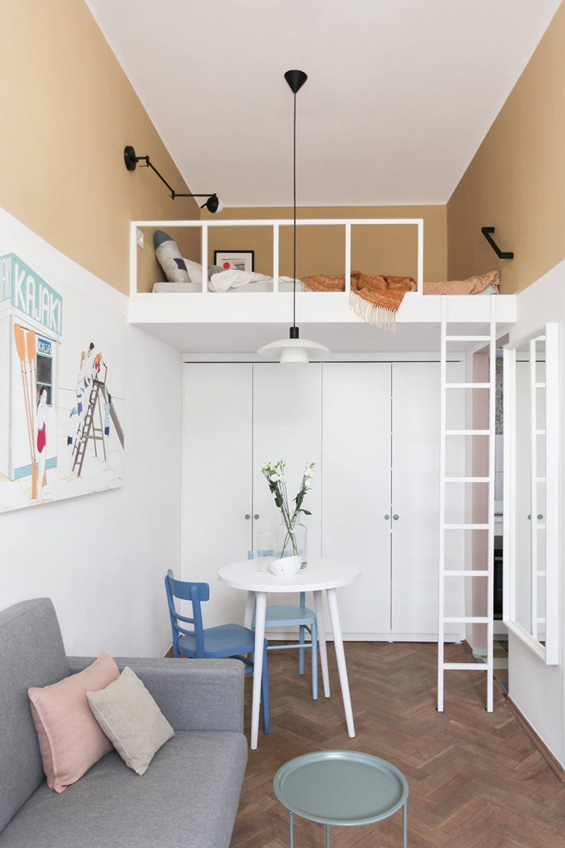 This tiny apartment is just 23 sqm and is done in a soft pastel color palette for a girl