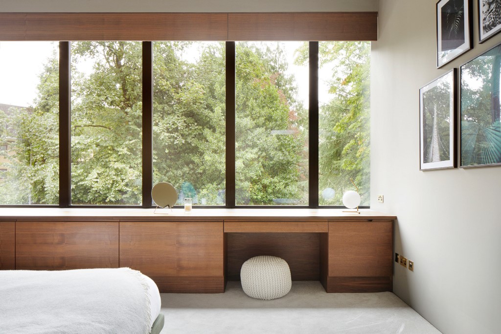 Bespoke walnut joinery features in the bedrooms