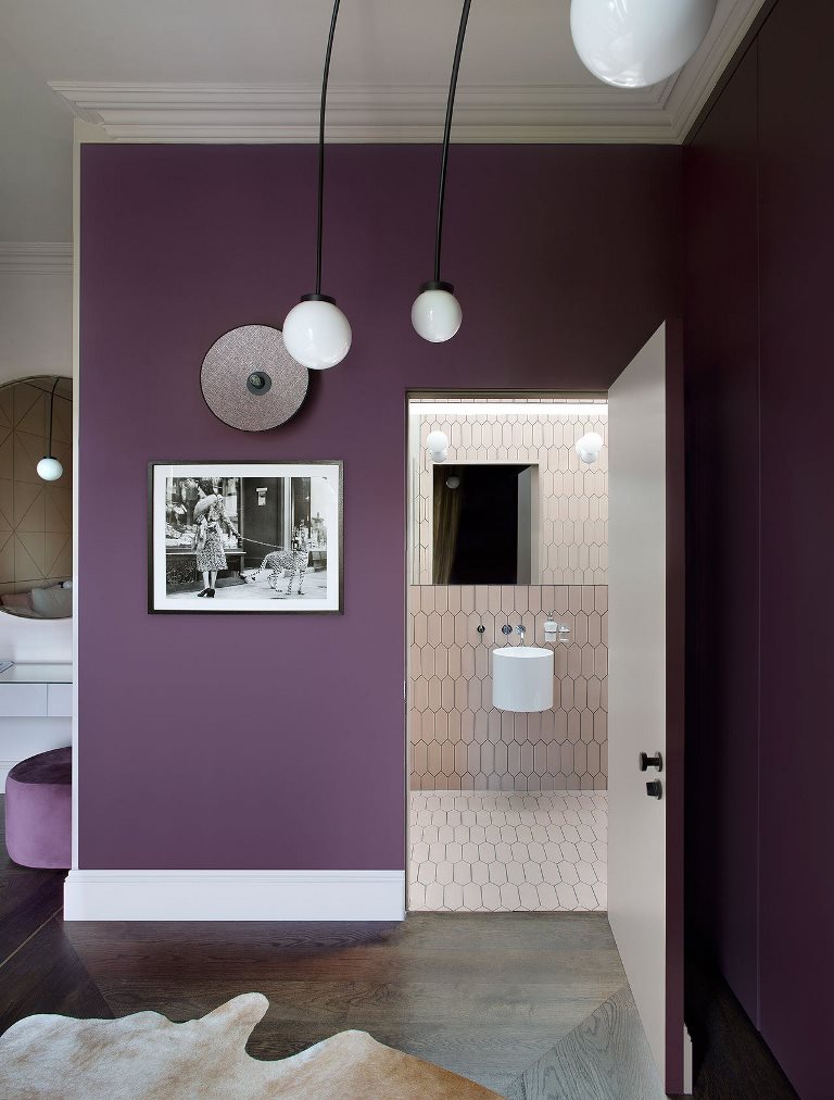 The master bathroom shows off blush tiles and white appliances