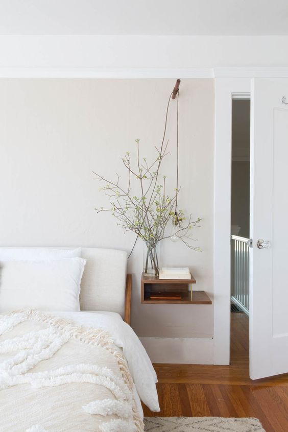 20 a calming and welcoming bedroom with a floating sleek nightstand with storage space is amazing