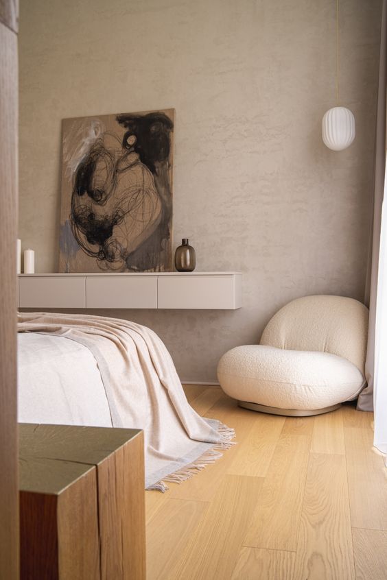 a welcoming neutral bedroom in Japandi style, in greys, creamy and earthy tones is very chic and cool